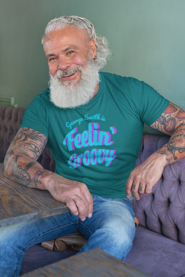 Senior man modeling Feelin’ Groovy personalized retro tee in casual setting