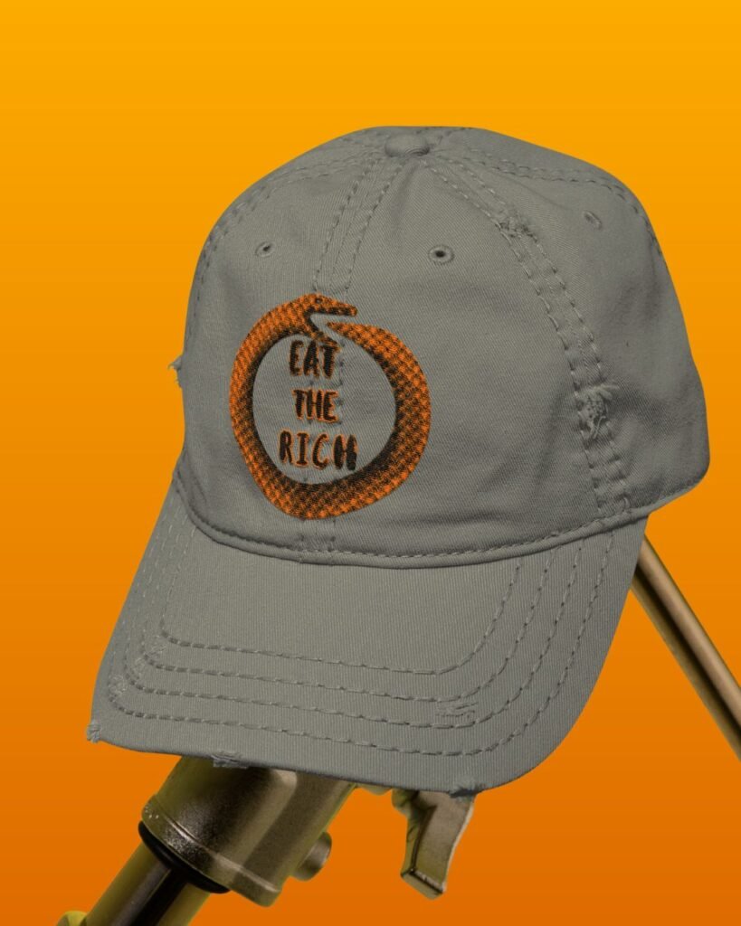 Mockup of Distressed hat color nichol gray with Orange snake and Eat the Rich slogan